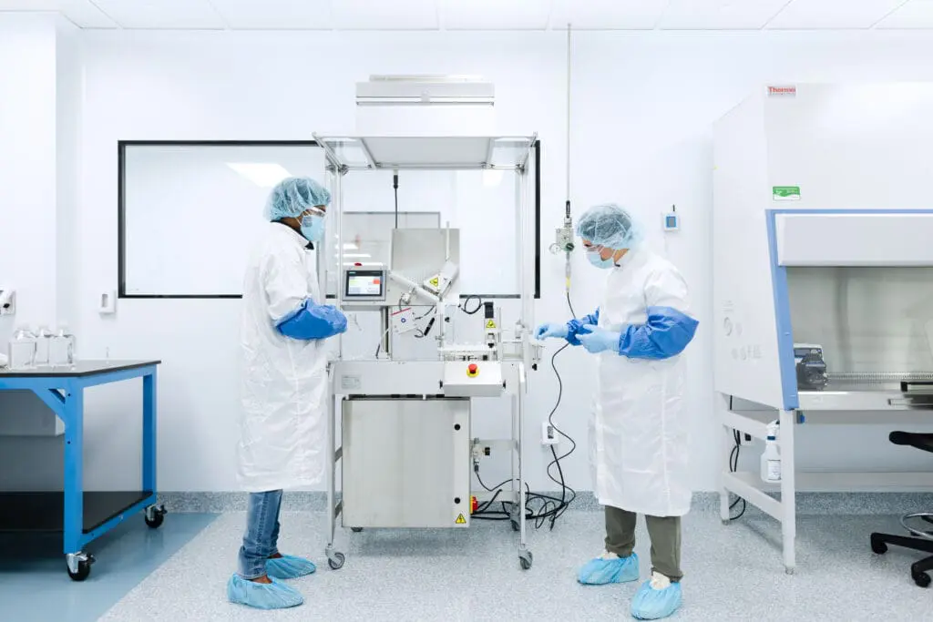 Image showing Boston Bio employee process liquids in cleanroom